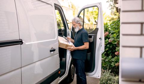 Man standing outside commercial vehicle