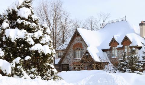 home during the winter covered in snow