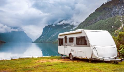 RV/trailer by a mountain and lake scenic