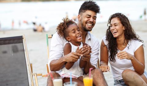 Family in kitchen laughing