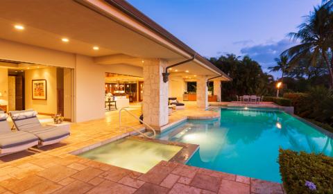 Outdoor in-ground pool outside nice home