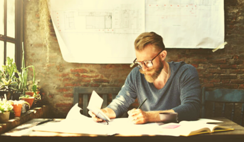 Man with beard working from home